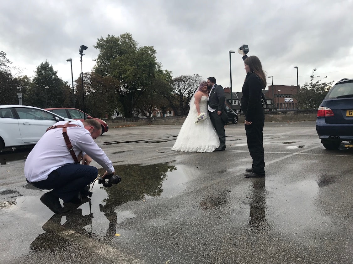 Wedding photography in a car park behind the scenes
